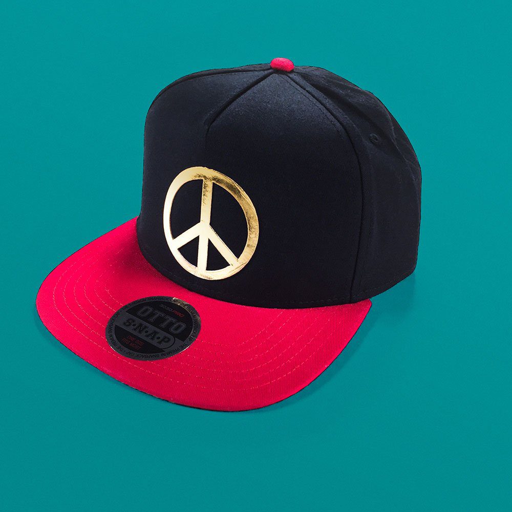 Siser Metal Gold peace design pressed on a cap